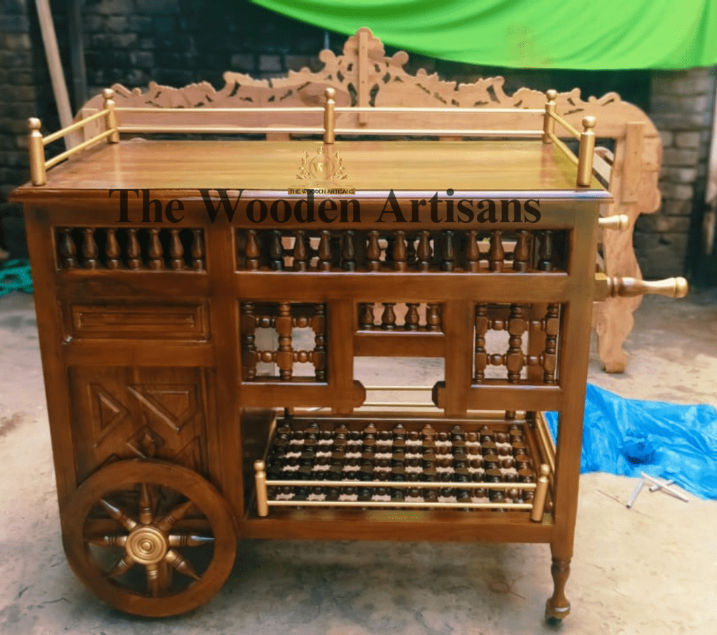 "Handcrafted wooden service trolley with brass accents and wooden wheels, designed by The Wooden Artisans for elegant home and hospitality use."